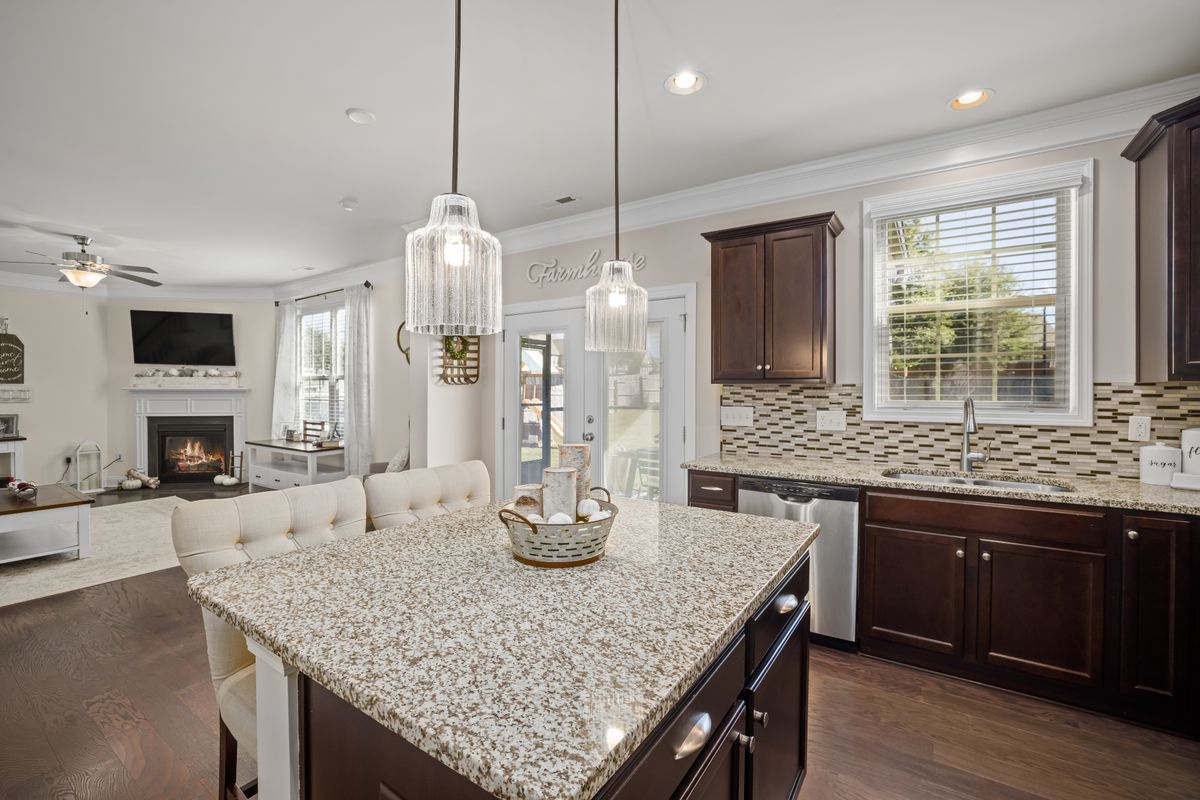 Modern kitchen island and living area — Kitchen with practical work surfaces