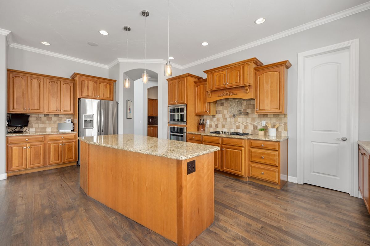Kitchen with generous island — Kitchen island and dining zone