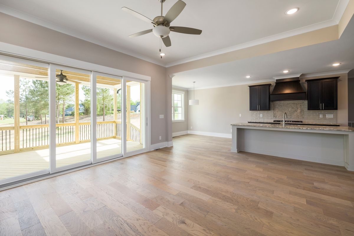 House with Wooden Flooring — Room facing an outdoor terrace